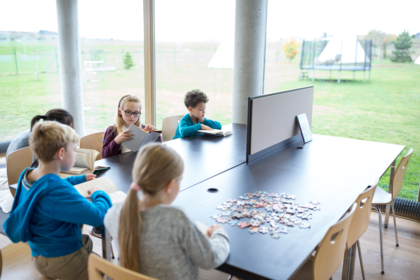 pupils-reading-books-on-table-in-school-break-room-2026-01-05-00-45-25-utc